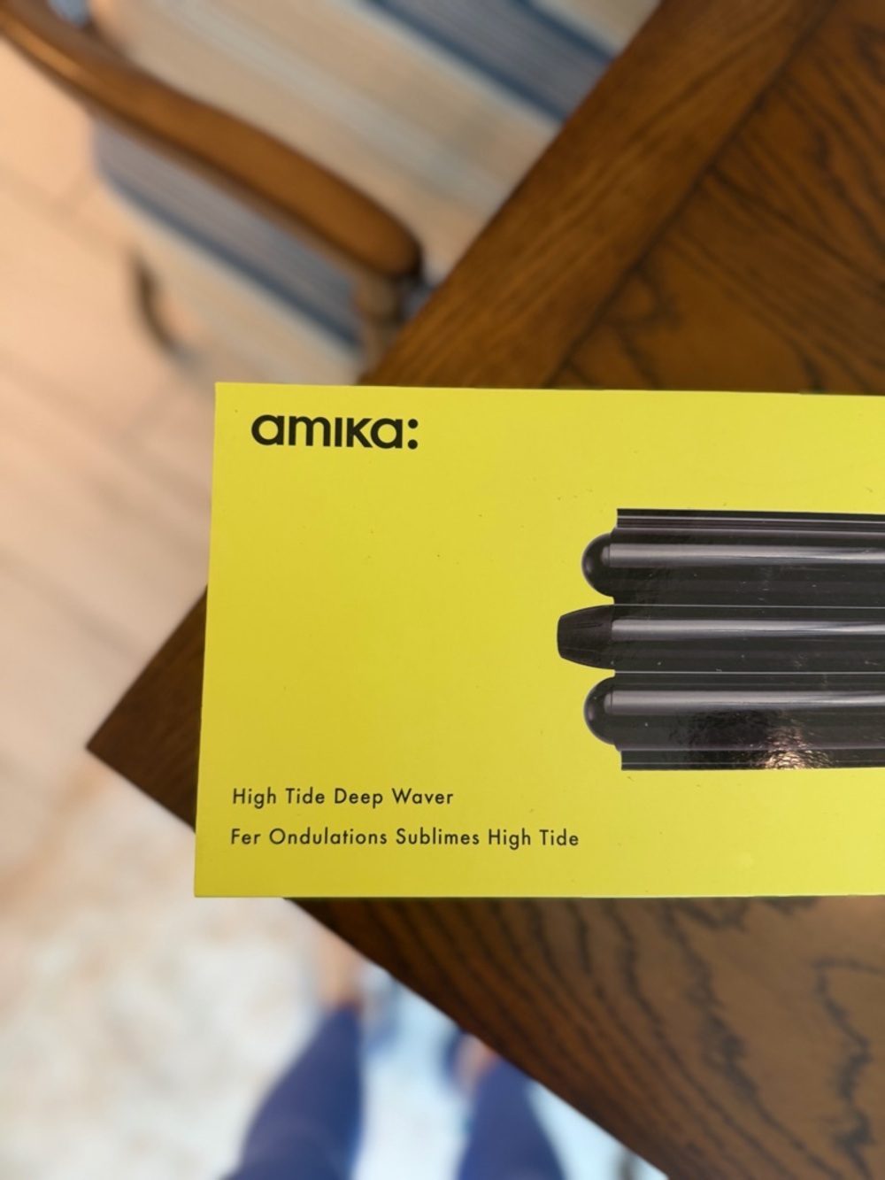 amika Styling Iron with Black Handle on Neon Yellow Packaging